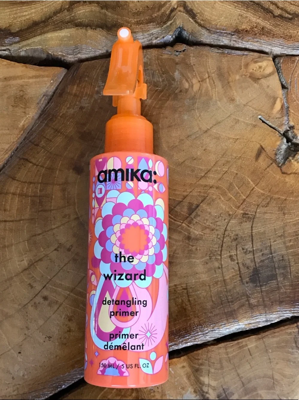 amika The Wizard Detangling Primer - Orange & Pink Floral Bottle